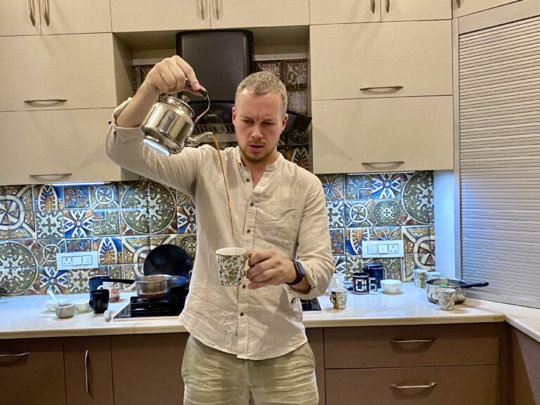 Guest pouring Chai in Cup